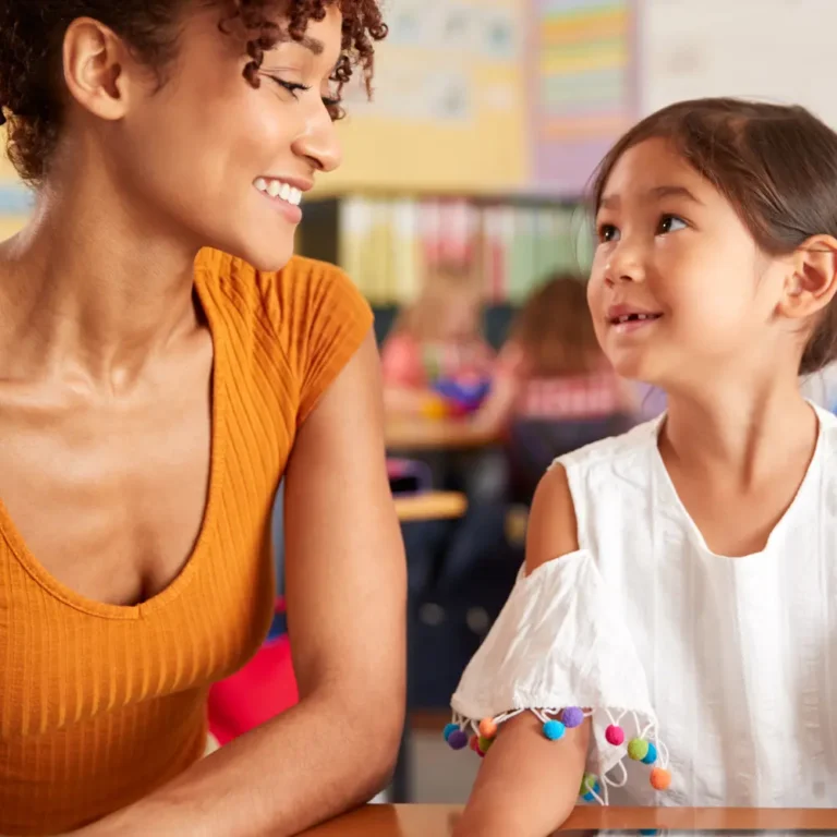 A woman and child sitting at a table